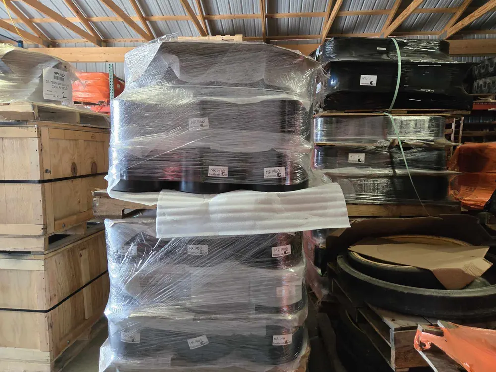 Shrink-wrapped pallets of new tracks in the Track Farmer warehouse, Long Prairie MN